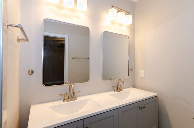 Bathroom featuring a sink and double vanity | Image 11