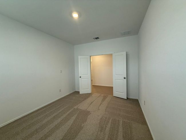 Unfurnished bedroom with carpet and baseboards | Image 16