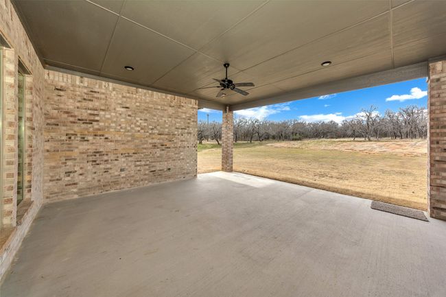 View of patio / terrace with a ceiling fan | Image 37