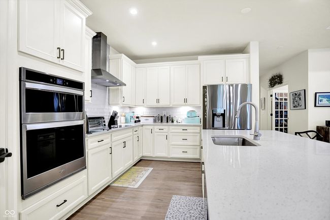 Quartz counters and ample cabinetry Great choices. | Image 7