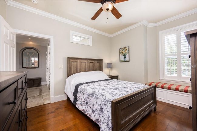 Bedroom 2 with adorable window bench seat, walk in closet, and access to own bathroom. | Image 19