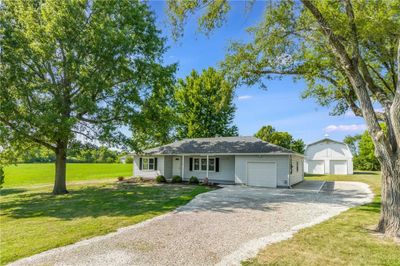 Ranch-style home with a front lawn | Image 1