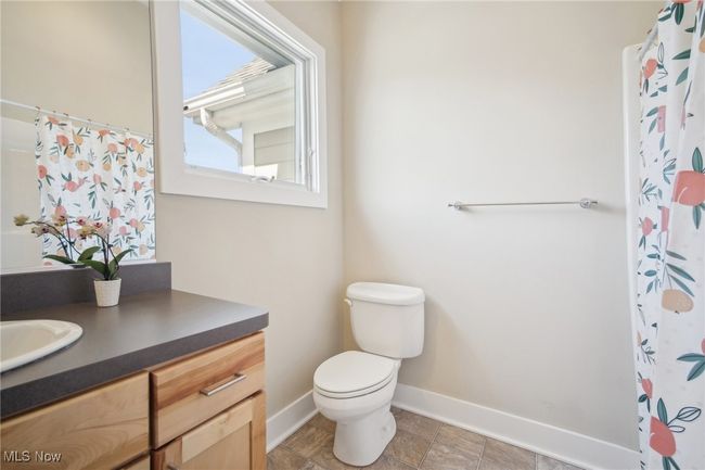 Full bath featuring baseboards, toilet, and vanity | Image 25
