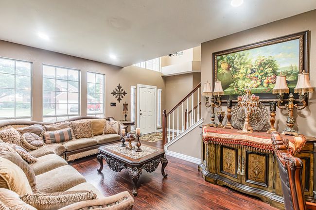 Living room with wood finished floors, stairs, and recessed lighting | Image 7