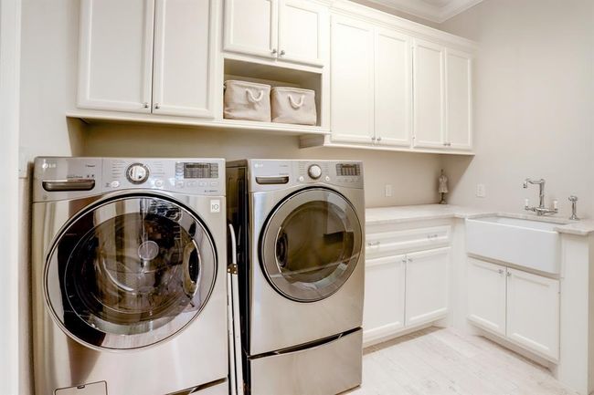 Downstairs laundry room just off the primary closet. | Image 24