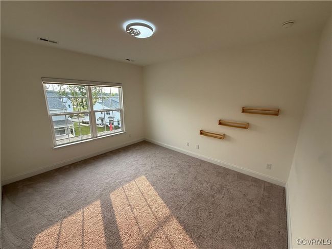 Carpeted spare room featuring baseboards | Image 13