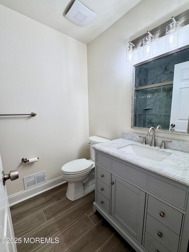 Second full bath with light gray vanity and porcelain tile | Image 26