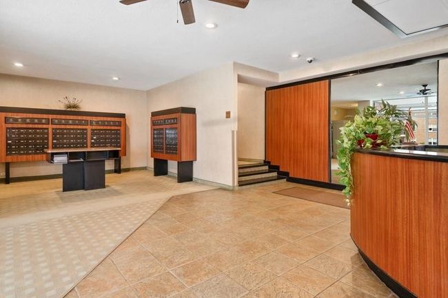 Reception with a ceiling fan, recessed lighting, and a surveillance system | Image 27
