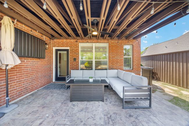 View of patio / terrace with outdoor lounge area, fence, and a ceiling fan | Image 27