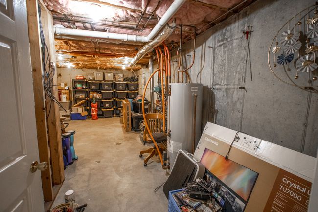 Unfinished below grade area with water heater | Image 41
