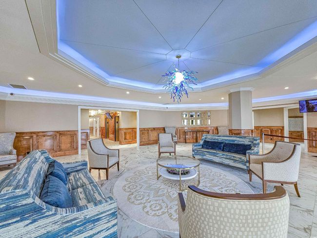Building lobby with wainscoting, crown molding, and recessed lighting | Image 34
