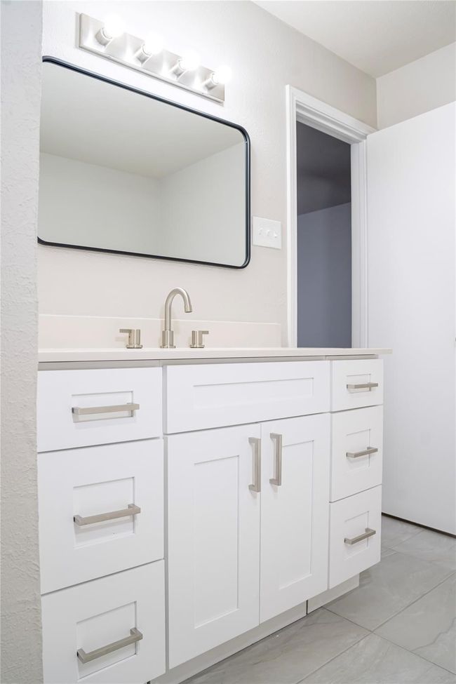 Bathroom featuring tile patterned floors and vanity | Image 7