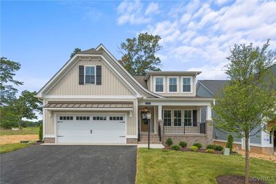 Craftsman inspired home featuring a garage, a front lawn, and a porch | Image 2