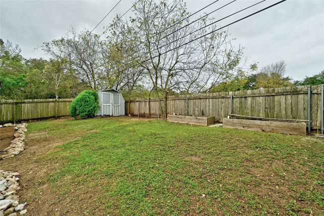 Note the raised garden beds and no backyard neighbor, make it a perfect setting for a peaceful evening to enjoy at home. | Image 26