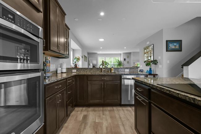 Larger kitchen offers space for additional 3 cabinets shown in photo, upper left. | Image 12