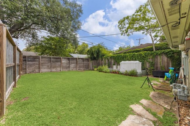 Expansive backyard perfect for outdoor activities and relaxation. | Image 22