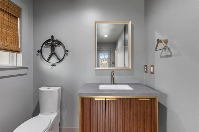 The mid-century styling of the primary bath fits perfectly. | Image 12