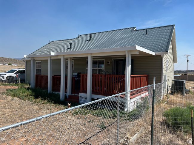 View of front of house with a porch and a metal roof | Image 6