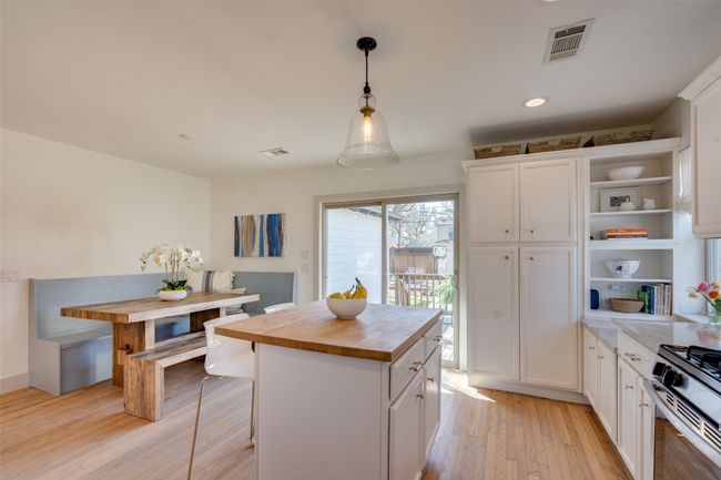 Kitchen featuring visible vents, open shelves, wood counters, white cabinets, and light wood finished floors | Image 9