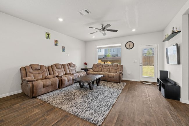 Living room featuring dark wood finished floors, ceiling fan, recessed lighting, and baseboards | Image 6