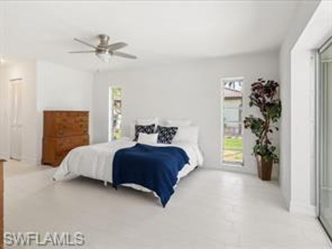 Bedroom featuring ceiling fan and access to outside | Image 11