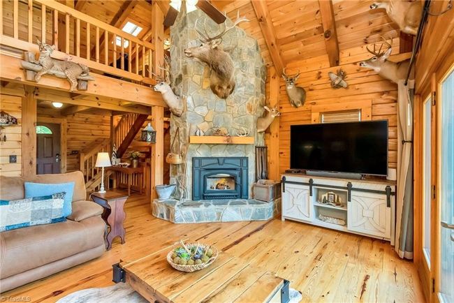 The large kitchen boasts a huge granite island and countertops, offering both ample workspace and a focal point for culinary gatherings. | Image 20