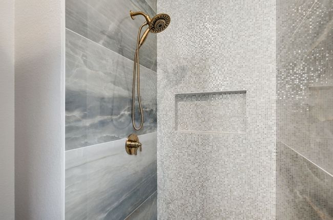 Bathroom view of a tile shower | Image 21