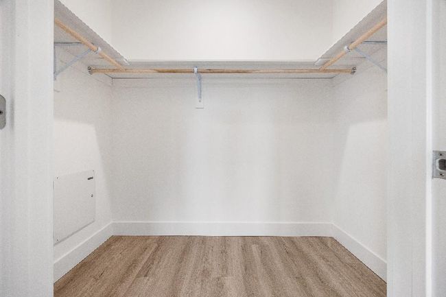 Spacious closet featuring wood finished floors | Image 22
