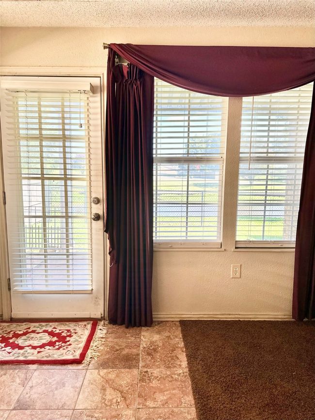 Den Door to backyard and water front pond | Image 26
