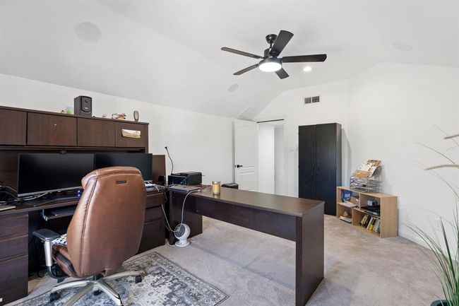 Another look at the versatile room, ideal for a study or game room. Large windows and an elevated ceiling create a bright and open atmosphere. | Image 33