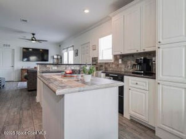 623 Hyacinth Cir, House other with 3 bedrooms, 2 bathrooms and null parking in Barefoot Bay FL | Image 22