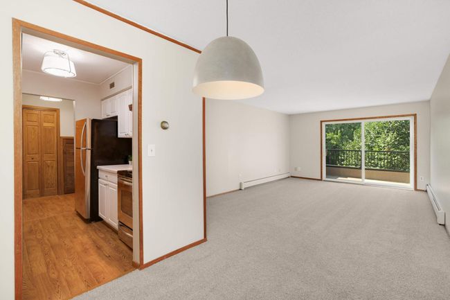 Living room opens up to the dining room | Image 6