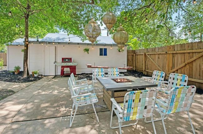 Back patio with a fire pit and grilling area | Image 31