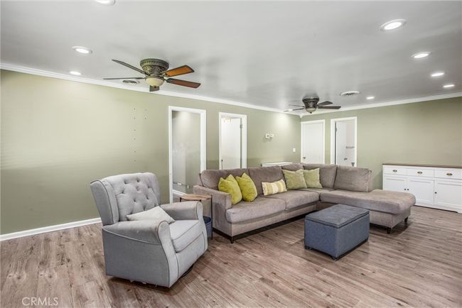 Another look of the family room with access to the garage and bathroom. | Image 20