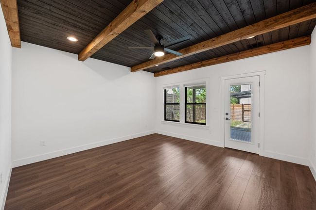Primary bedroom with gorgeous, beamed ceilings | Image 13
