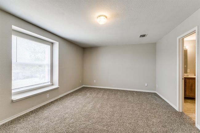 Empty room featuring a textured ceiling and carpet flooring | Image 19