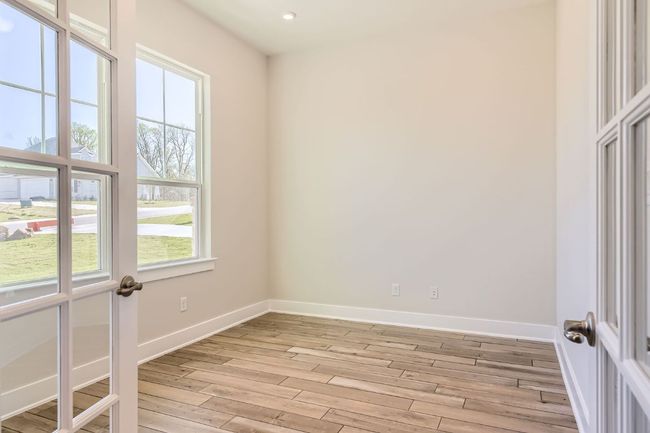 Spare room featuring light wood-type flooring, baseboards, and recessed lighting | Image 16