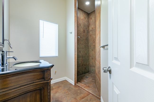 Full bath with tiled shower and vanity | Image 12