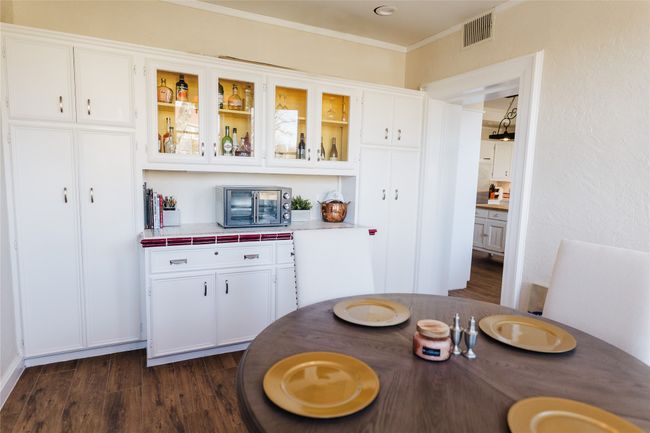 Dining room with dark hardwood / wood-style flooring and ornamental molding | Image 21