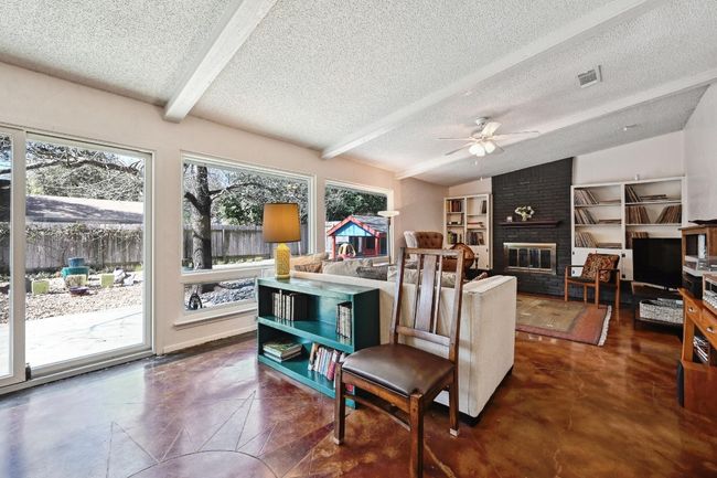 Beamed high ceilings in the living space. | Image 6