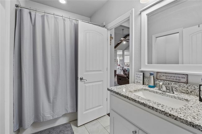Bathroom that is open to bedroom 2 and the main living area. | Image 25