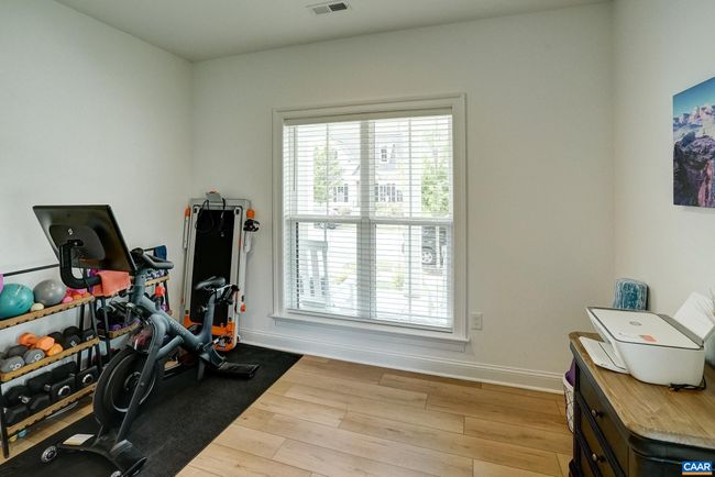 Flexible space at the front of the home could be a home office, workout space, or guest bedroom. | Image 7