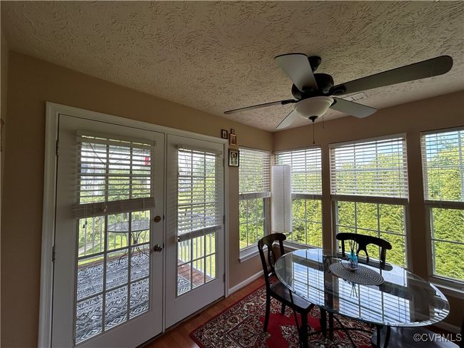with access to balcony overlooking woods | Image 10