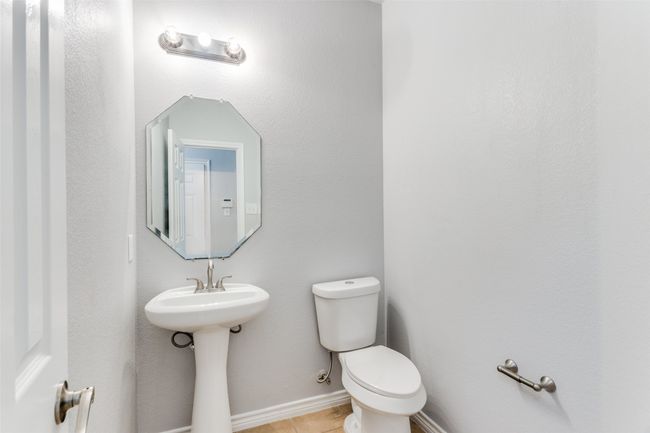 Bathroom with toilet and baseboards | Image 23