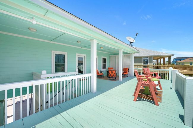 Large Deck and covered stairwell coming up has a locking door at the bottom which is perfect for security for out of town owners. | Image 35