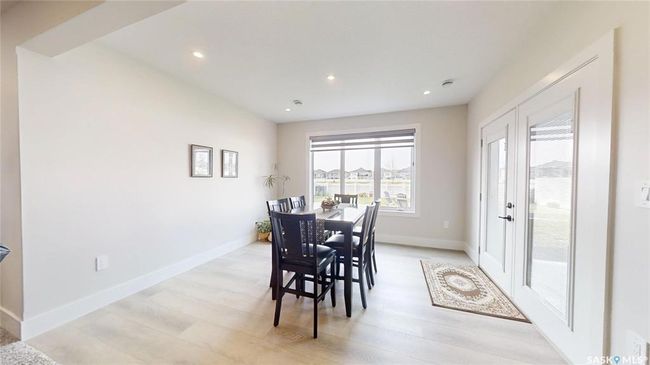 Dining area featuring light wood finished floors and recessed lighting | Image 29