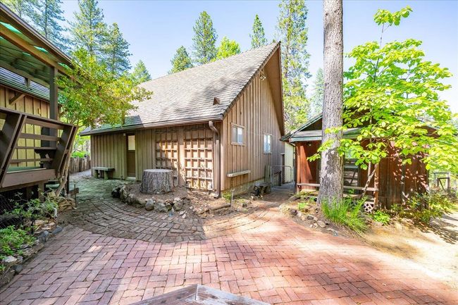 Detached garage and artist studio tucked behind | Image 4