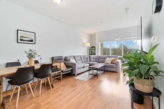 Living room featuring light wood-type flooring | Image 12