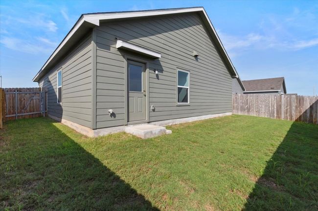 Back of property with a fenced backyard | Image 16