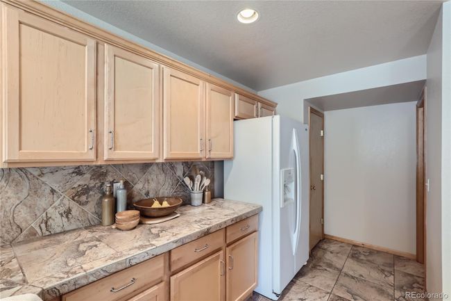 Kitchen with Pantry Right of Fridge | Image 13